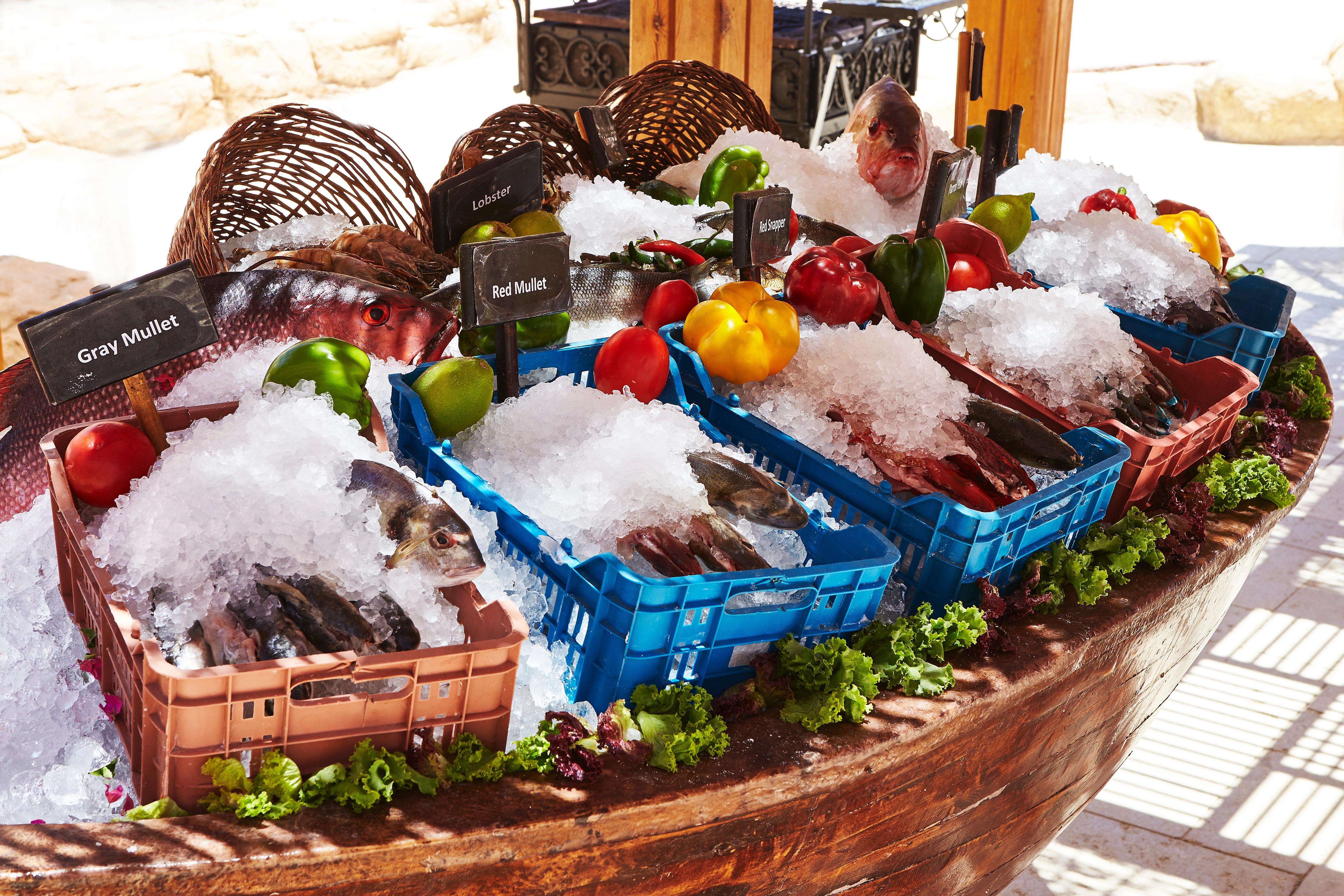 Kempinski Hotel Soma Bay Exterior photo Fish and vegetables at a market